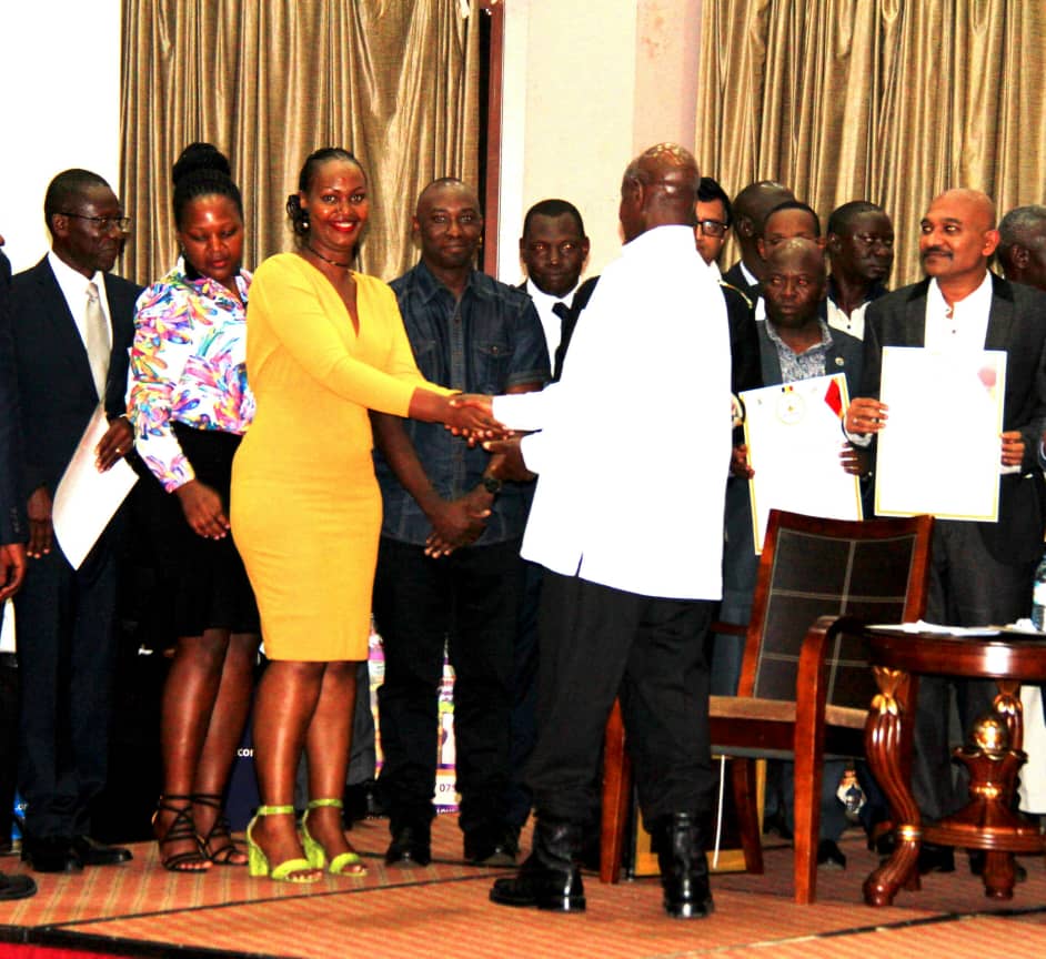 NAPE staff shaking the hand of the president after receiving the award