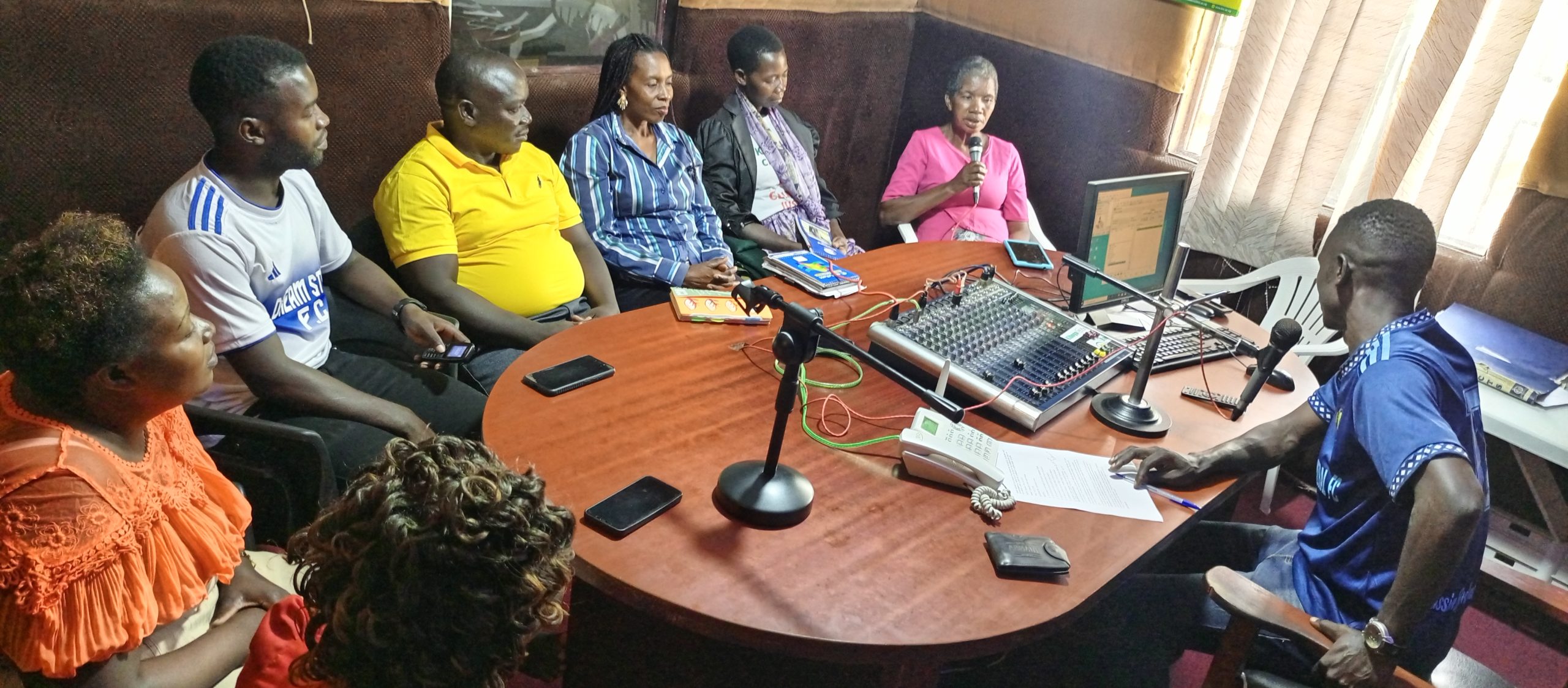 Community members in studios of Community Green Radio during a talk show recently.