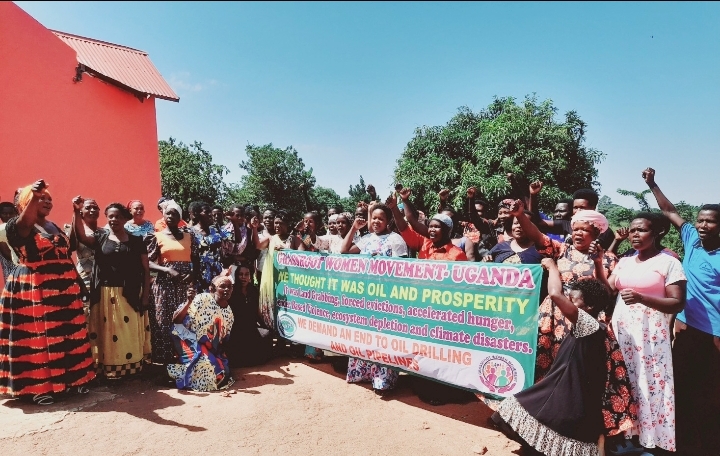 The women from the EACOP affected areas pose for a group photo after the outreach meeting with NAPE and the Community Green Radio staff in Buseruka Sub county Hoima District