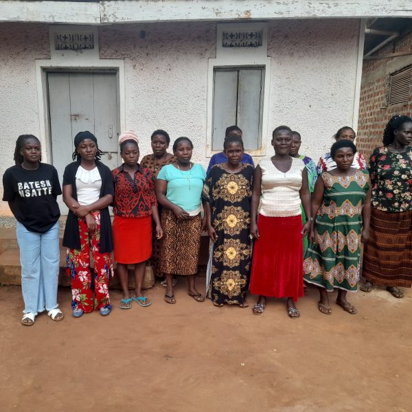 Our reporter, Nteza Joan(L) pose for a photo with Women affected by EACOP in Lwanda in Kiboga District.