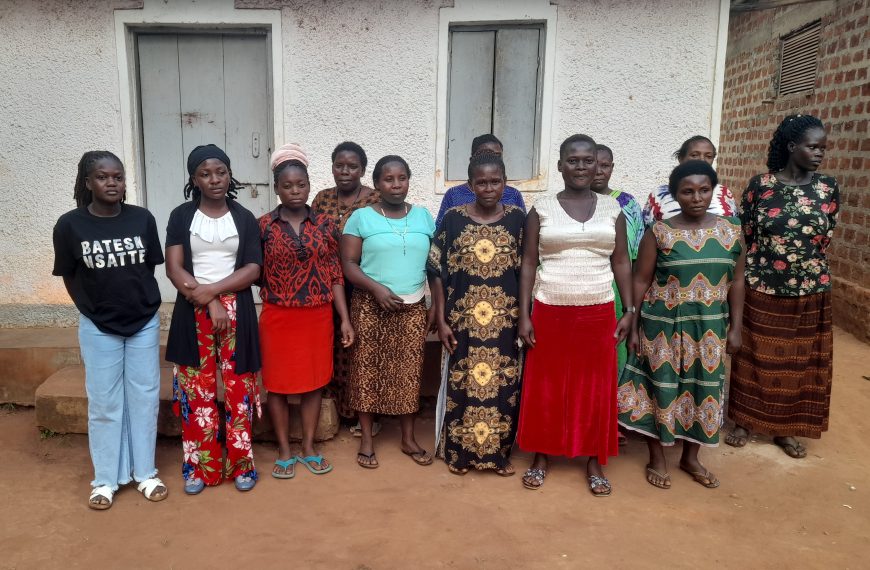 Our reporter, Nteza Joan(L) pose for a photo with Women affected by EACOP in Lwanda in Kiboga District.